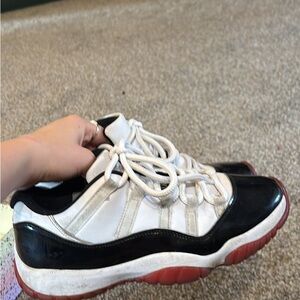 White and Black Sneakers with Red Soles